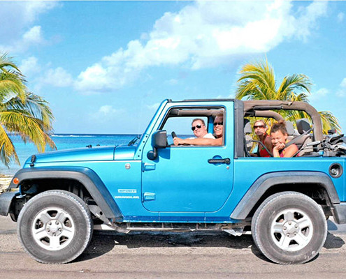 Family beach day in the Jeep